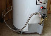 Recycle a hot water heater to help the environment. The reclamation workers will dismantle the units and collect all renewable materials.